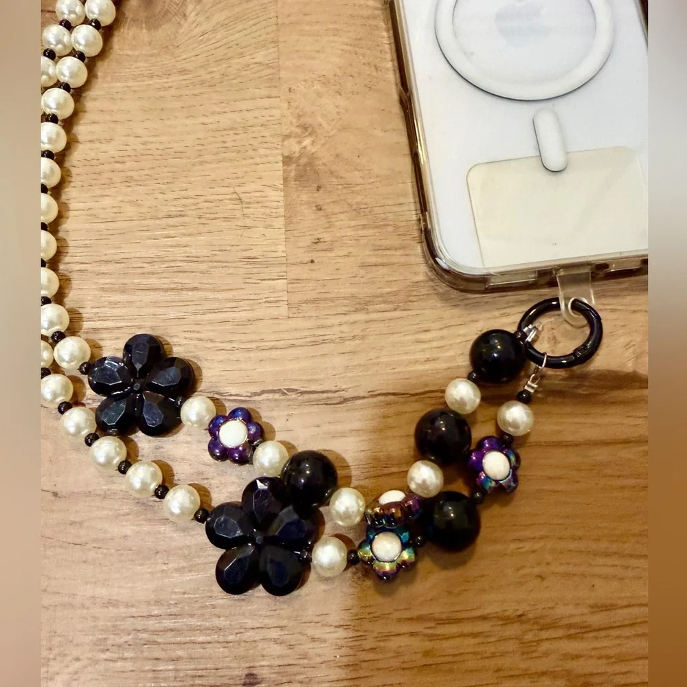 Elegant White and Black Phone Chain with Pearl Strap